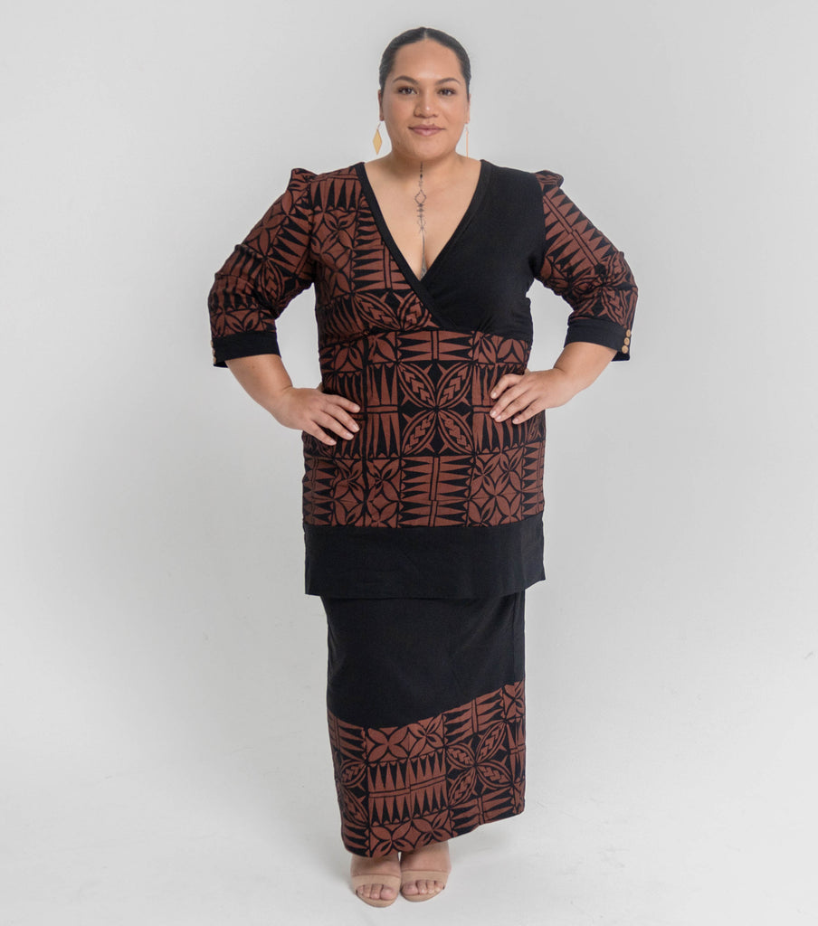 Model wearing elegant brown on black block-printed puletasi, handmade in Samoa.