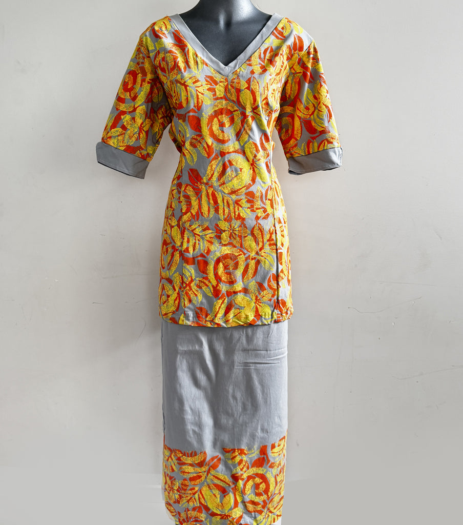 Elegant puletasi with vibrant yellow and orange prints on gray, made in Samoa.