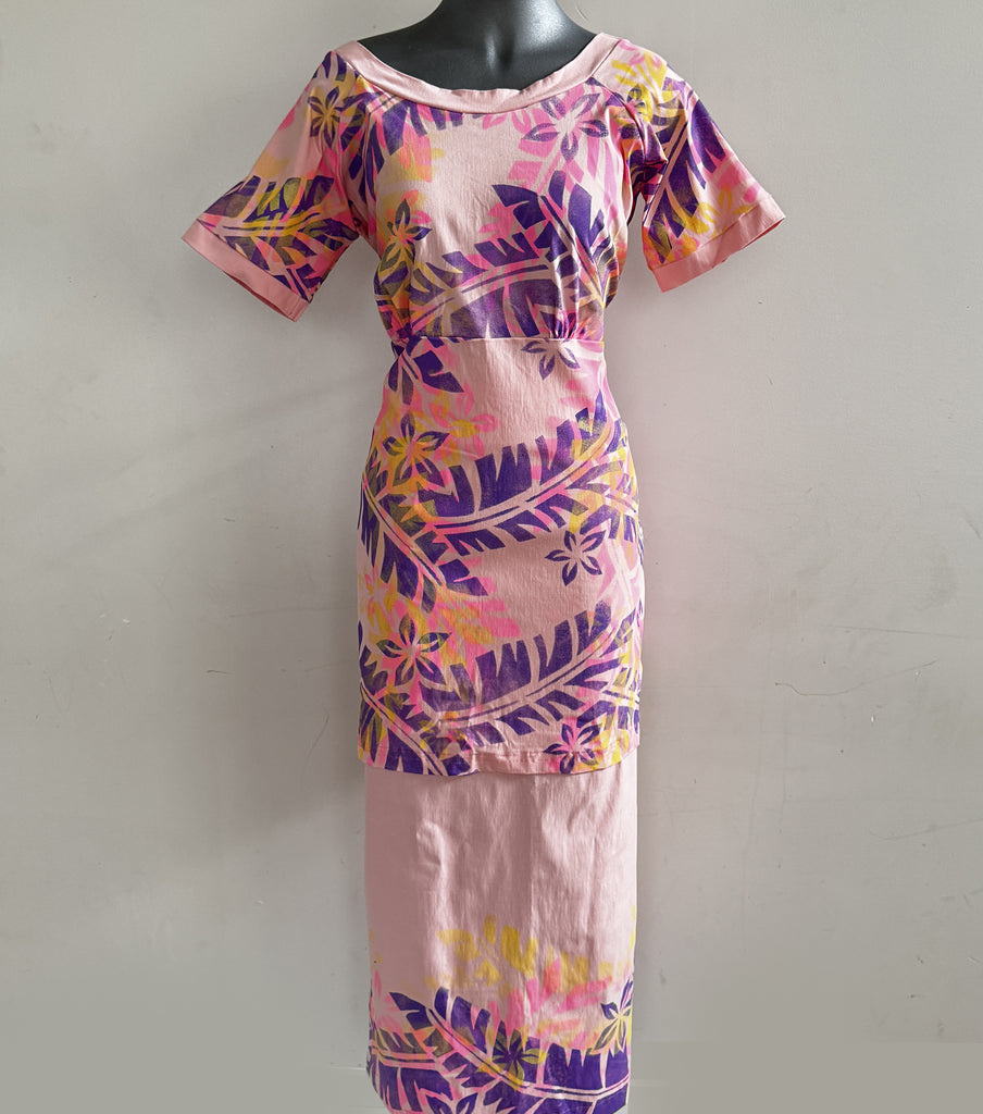 Elegant pink puletasi with vibrant purple and pink block prints, made in Samoa.