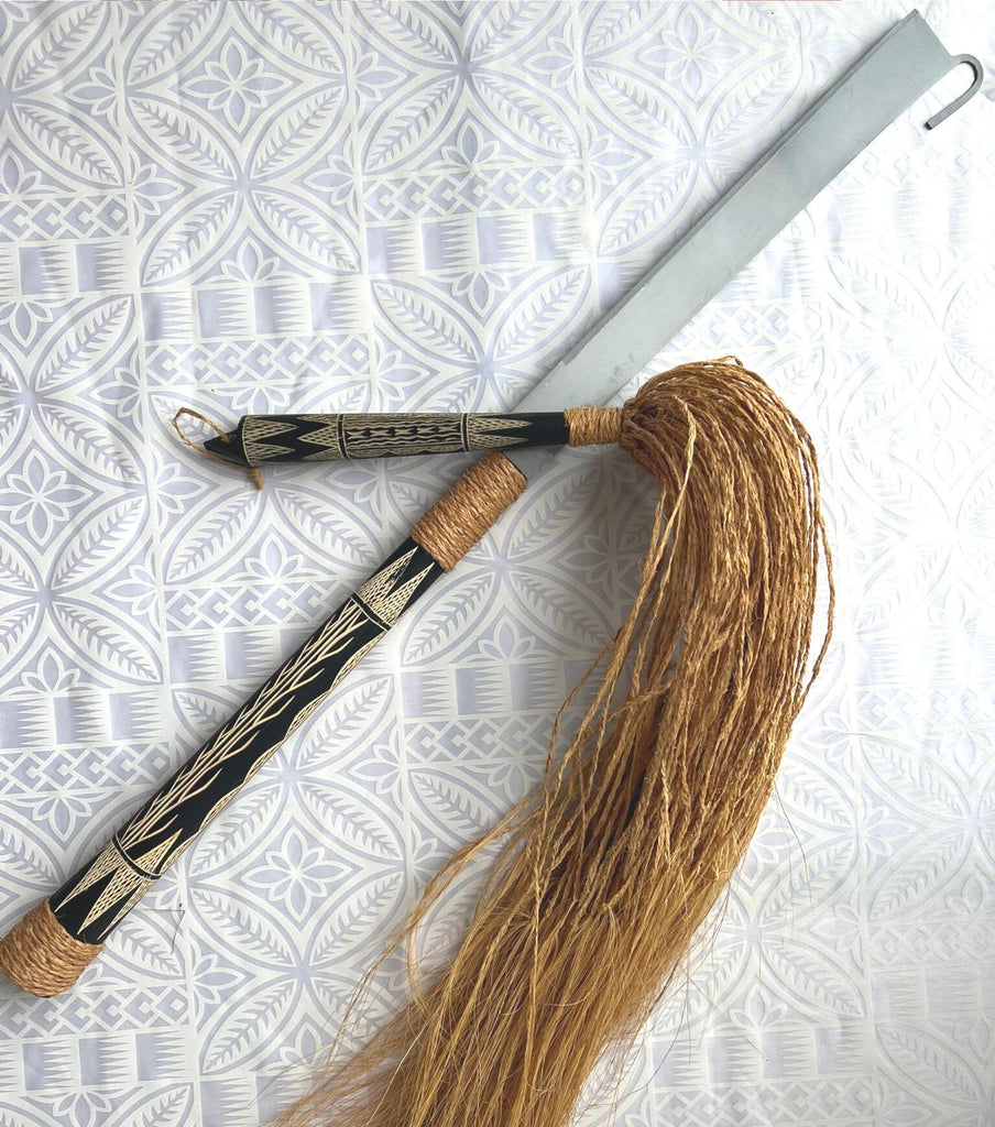 Traditional Samoan nifo oti (tooth of death) weapon featuring a curved wooden handle with sharp shark teeth meticulously bound along the edge using fine sennit cord, symbolizing cultural strength and craftsmanship.